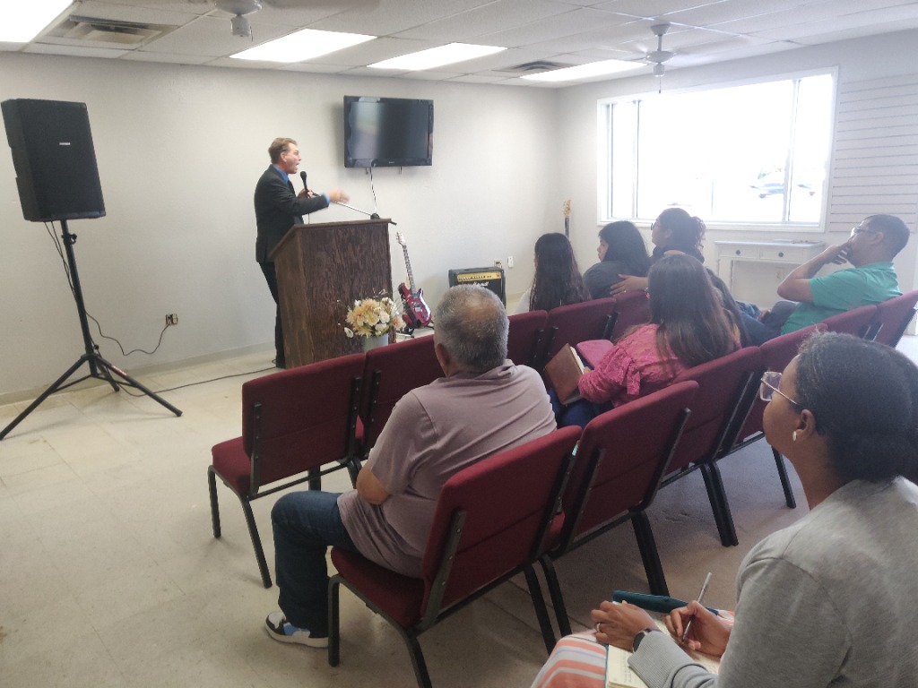 Pastor Edward May preaching at The Door Beeville